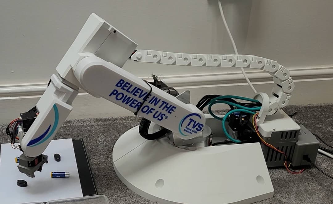 A robotic arm picking up an object.