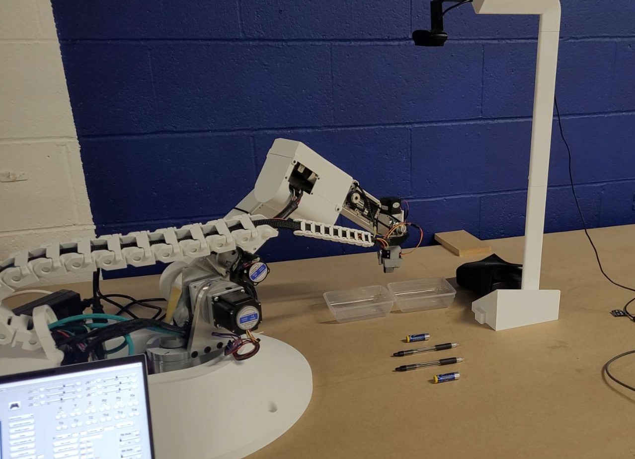 Robotic arm sorting items in a warehouse